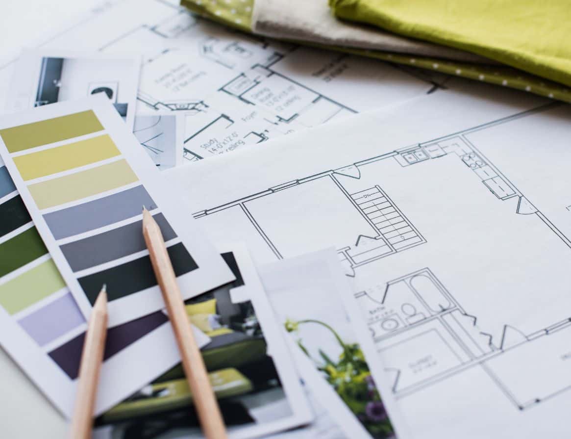 This image shows architectural floor plans with furniture layout, two pencils, fabric samples, and color swatches, used for e-design interior design planning.